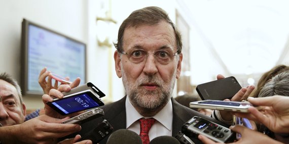Spain's Prime Minister Mariano Rajoy talks to reporters after a control session at Spanish parliament in Madrid, Spain